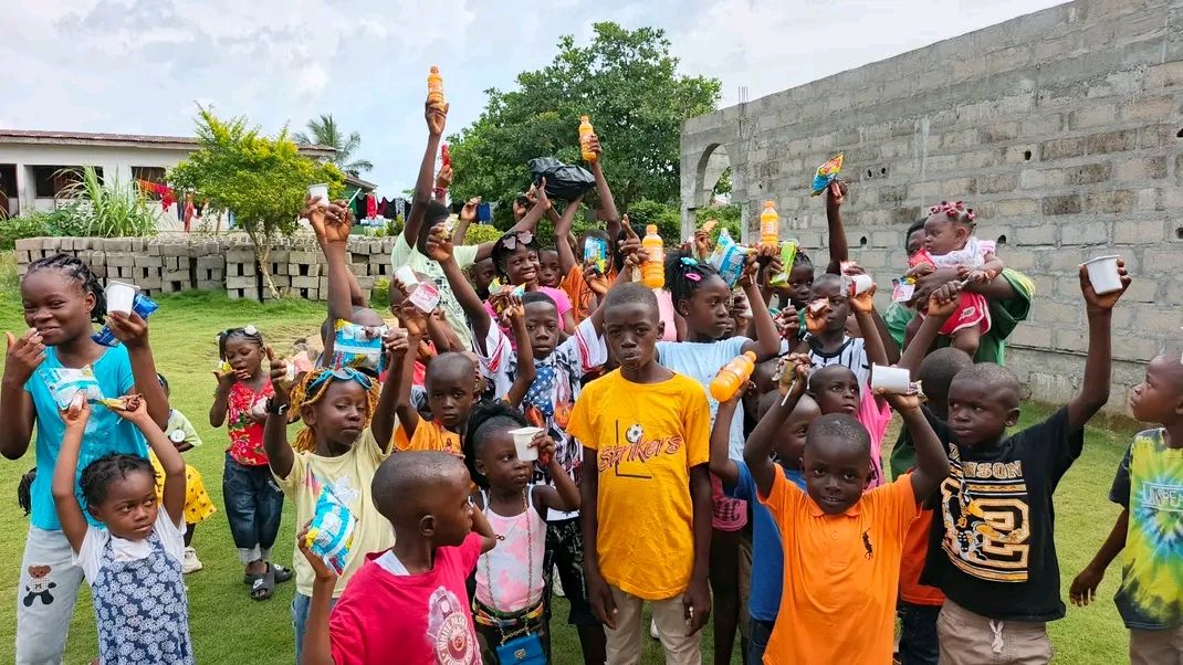 Children taking part in a community support programme in Liberia